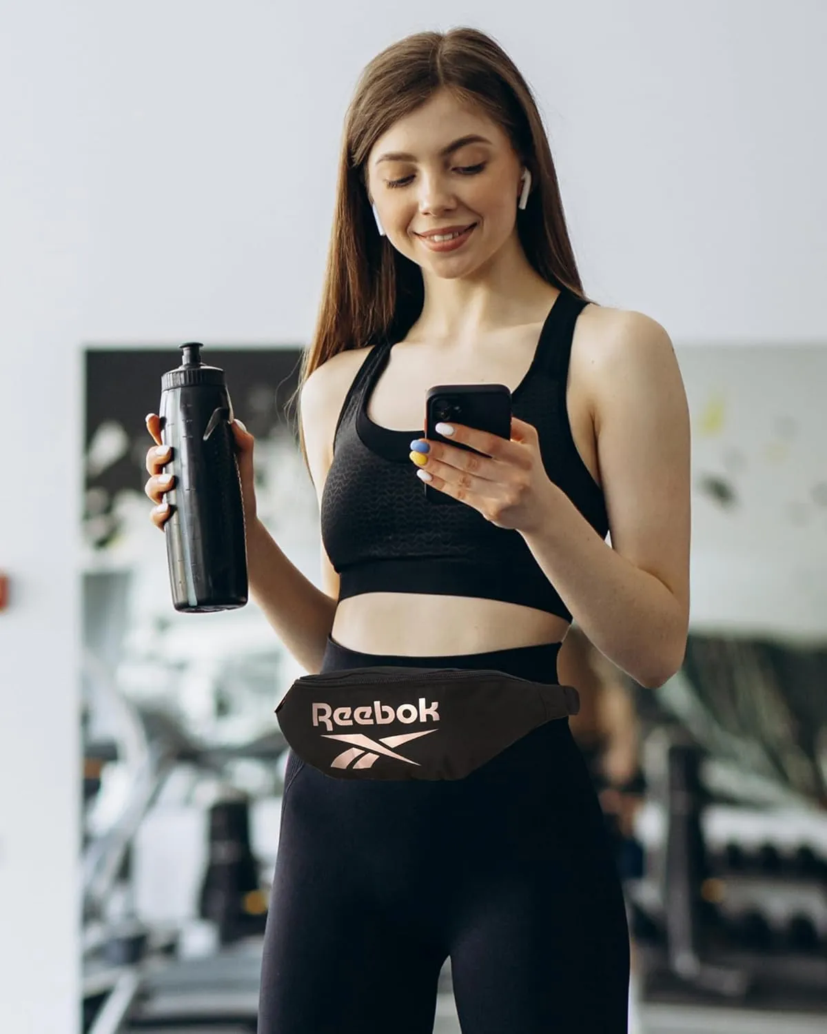 Reebok Fanny Pack - Lightweight Stylish Crossbody Waist Belt Bags for Women and Men with Adjustable Strap, Size One Size, Foundation Black With Rose Gold Logo