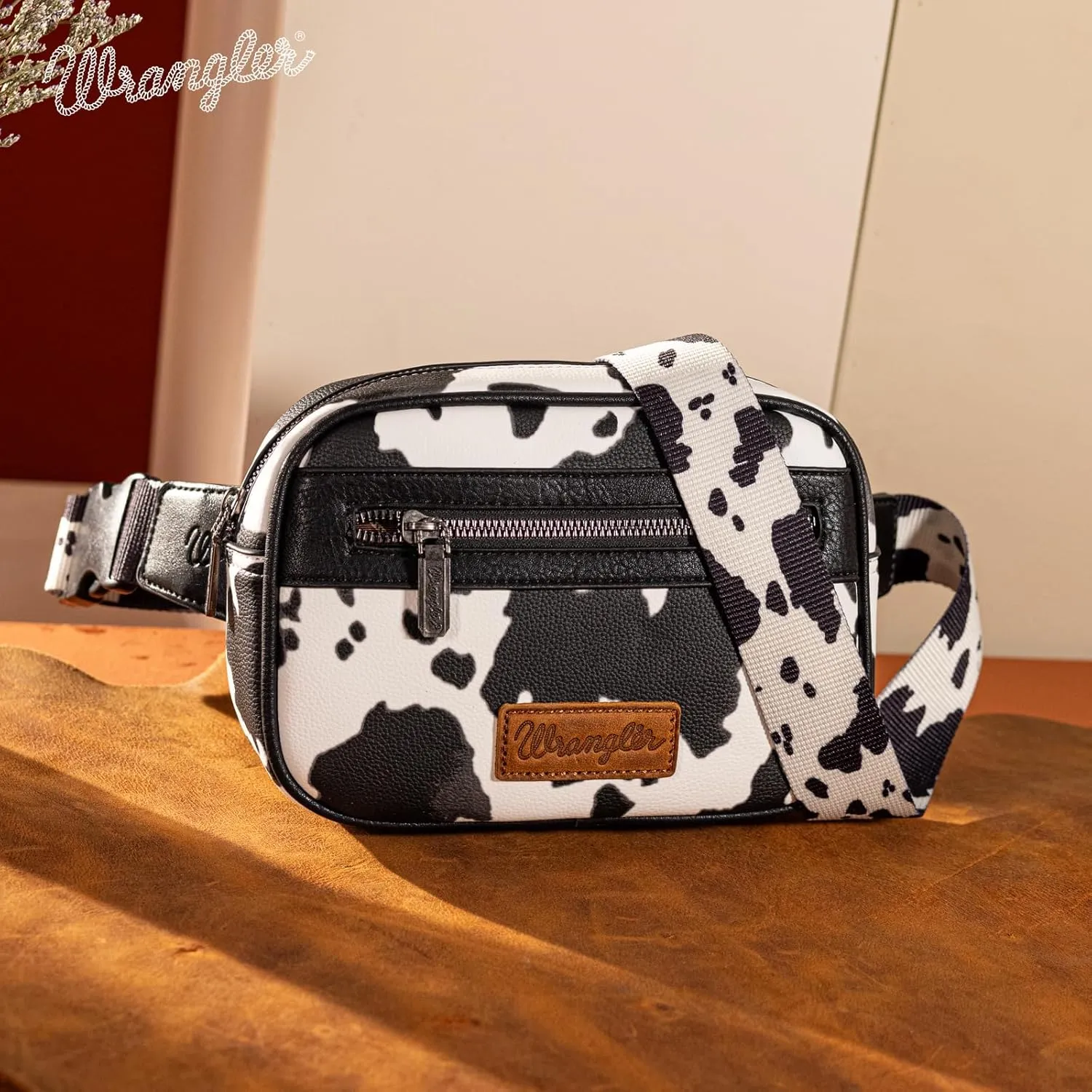 Wrangler Waist Pack for Women Cow Print Fanny Pack Men's Crossbody Belt Bag With Guitar Strap, Black
